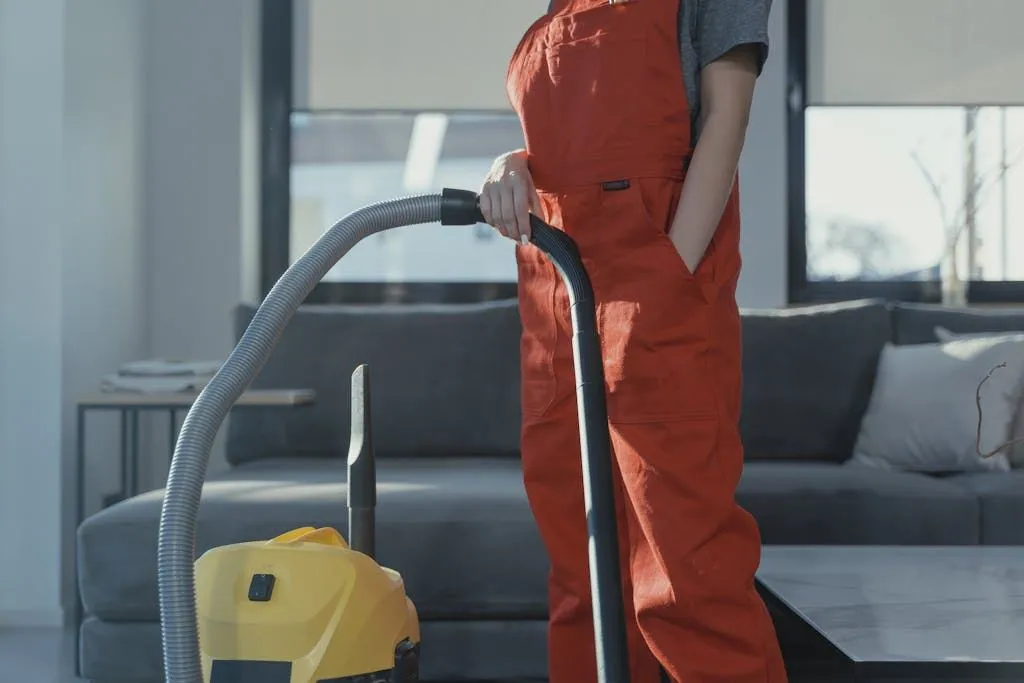 Person Holding a Vacuum Cleaner
